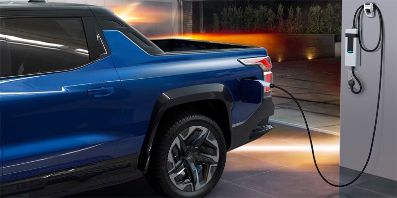 Close up of 2024 Chevrolet Silverado EV charging in a home garage